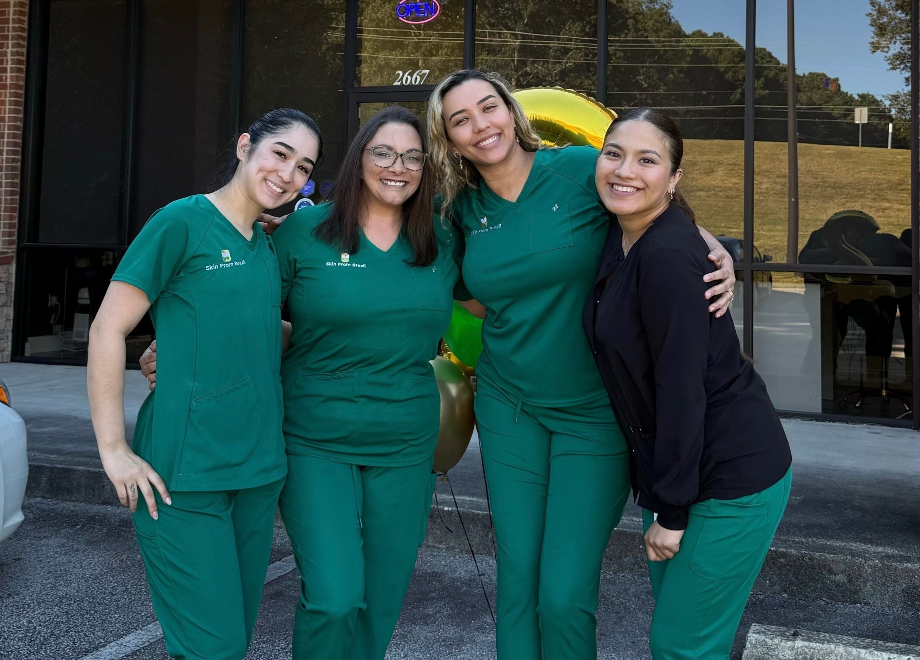 Friendly team of Skin From Brazil posing outside the venue in Stockbridge, Georgia, US.