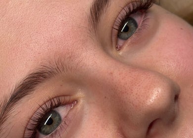 Close-up of a woman's radiant face at Aleighas Beauty, Guildford, England, GB.