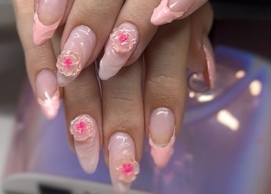 Intricate pink floral nail art at Zephyra Lounge in Silverdale, New South Wales, AU.