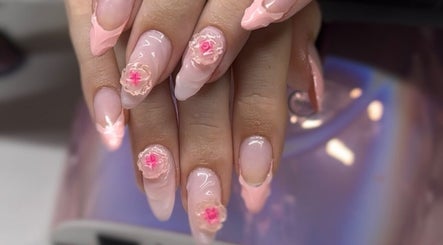 Intricate pink floral nail art at Zephyra Lounge in Silverdale, New South Wales, AU.