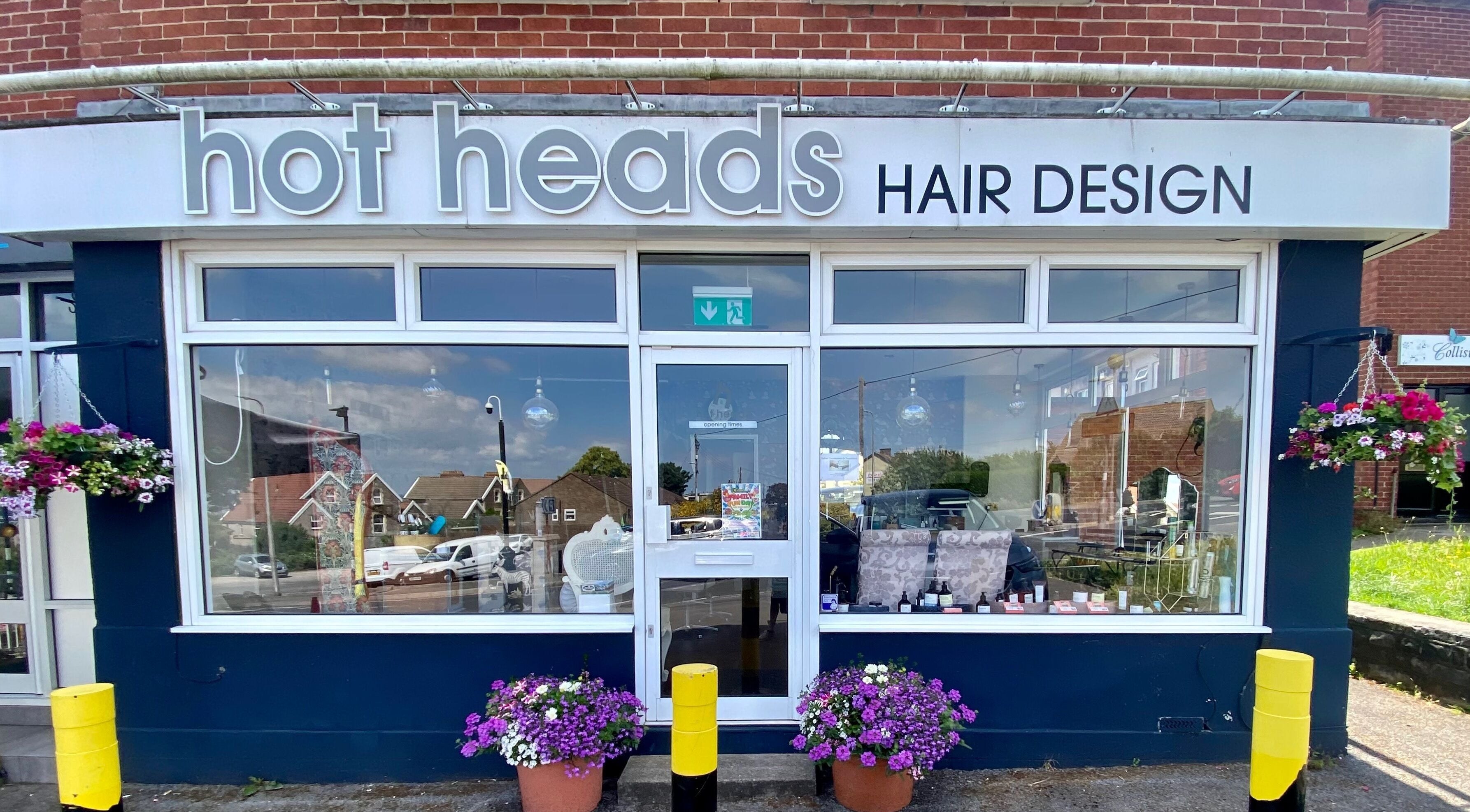 Hot Heads Hair Design exterior in Portishead, North Somerset, GB, with floral decorations and modern signage.