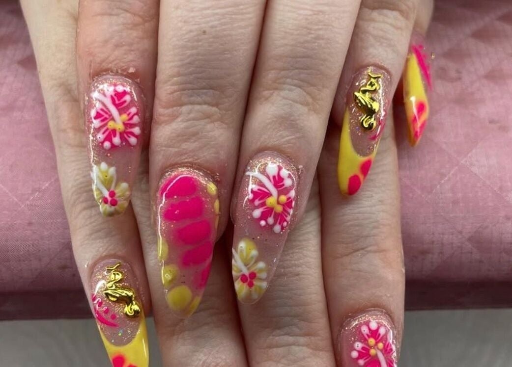 Floral nail art at RachB Beauty in Edenderry, County Offaly, IE features vibrant pink and yellow designs.