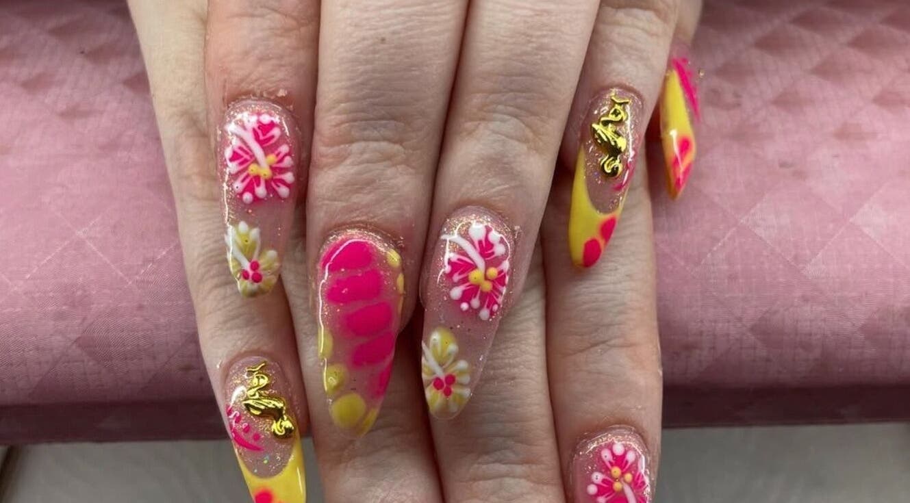 Floral nail art at RachB Beauty in Edenderry, County Offaly, IE features vibrant pink and yellow designs.