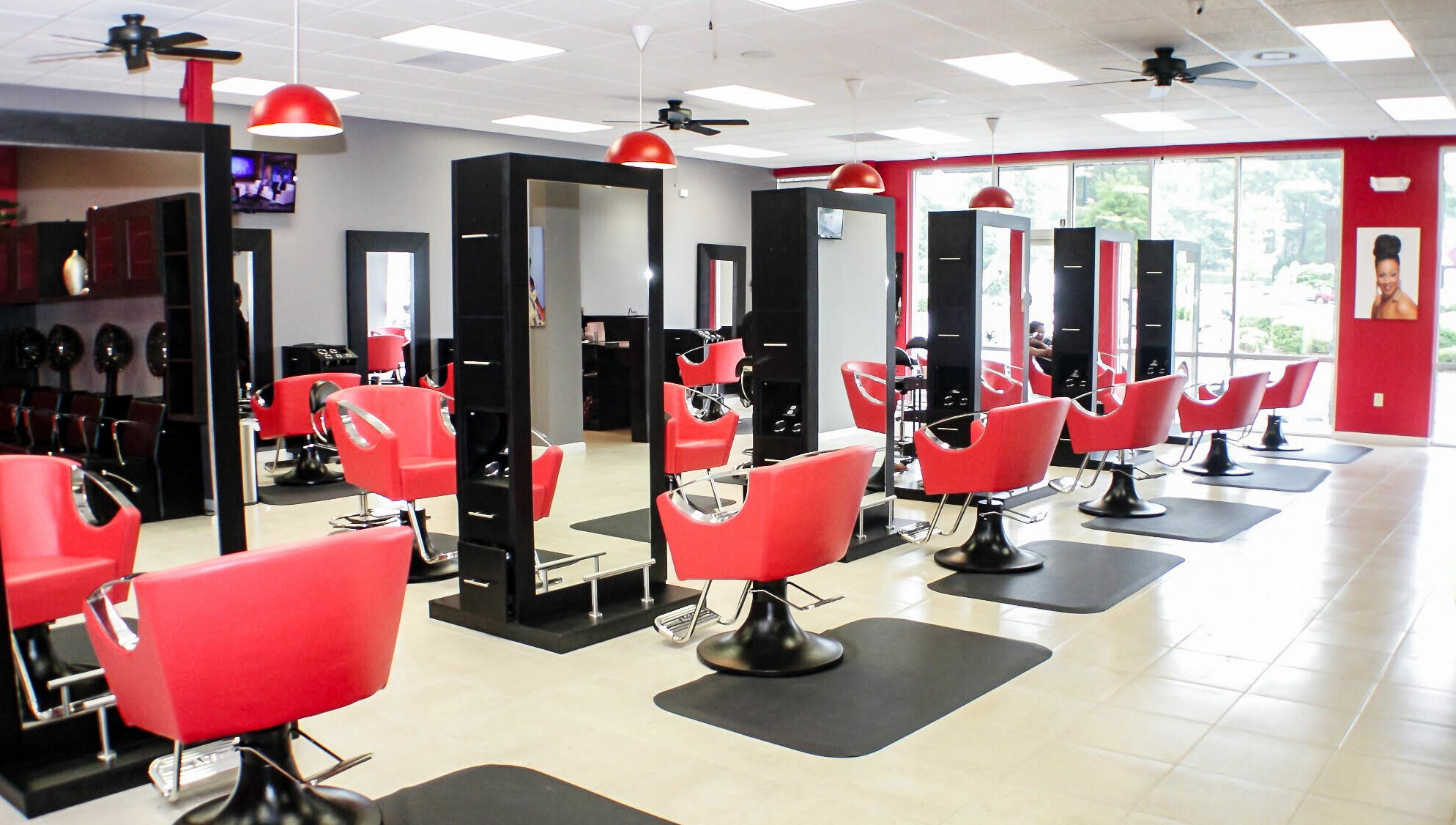 Modern salon with vibrant red chairs at Bignons on South Tryon, Charlotte, North Carolina, US.