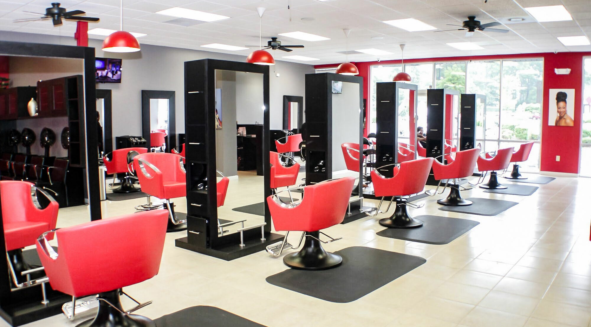 Modern salon with vibrant red chairs at Bignons on South Tryon, Charlotte, North Carolina, US.