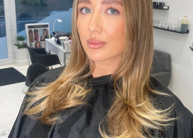 Woman with styled hair at Bymolliefay salon, Runcorn, England, GB.