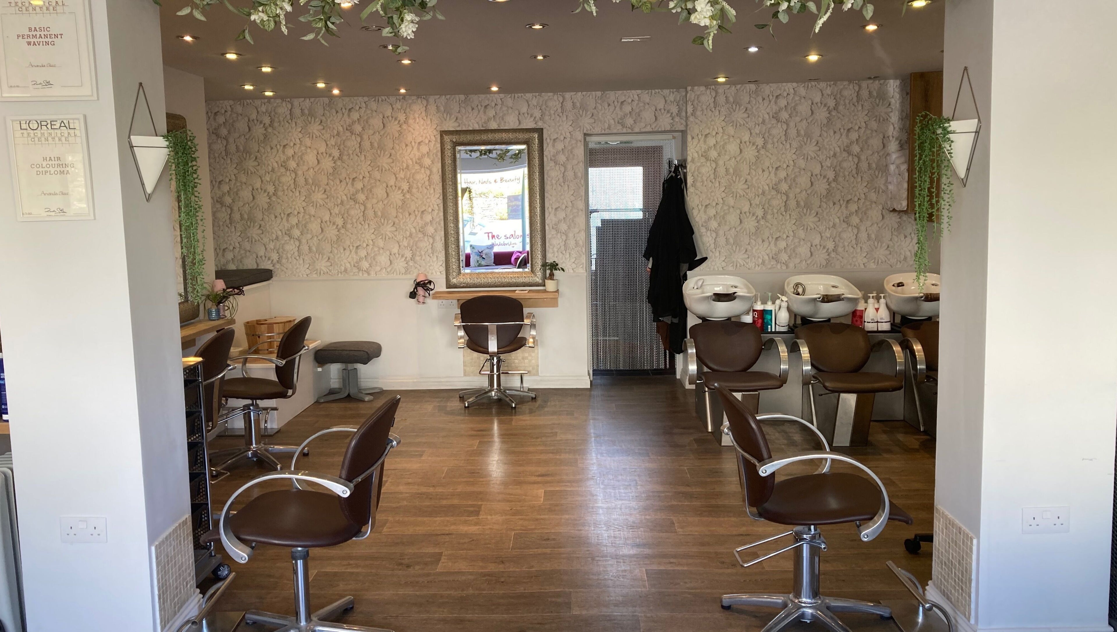 Interior of The Salon Wadebridge with stylish chairs and decor in Wadebridge, England, GB for beauty services.