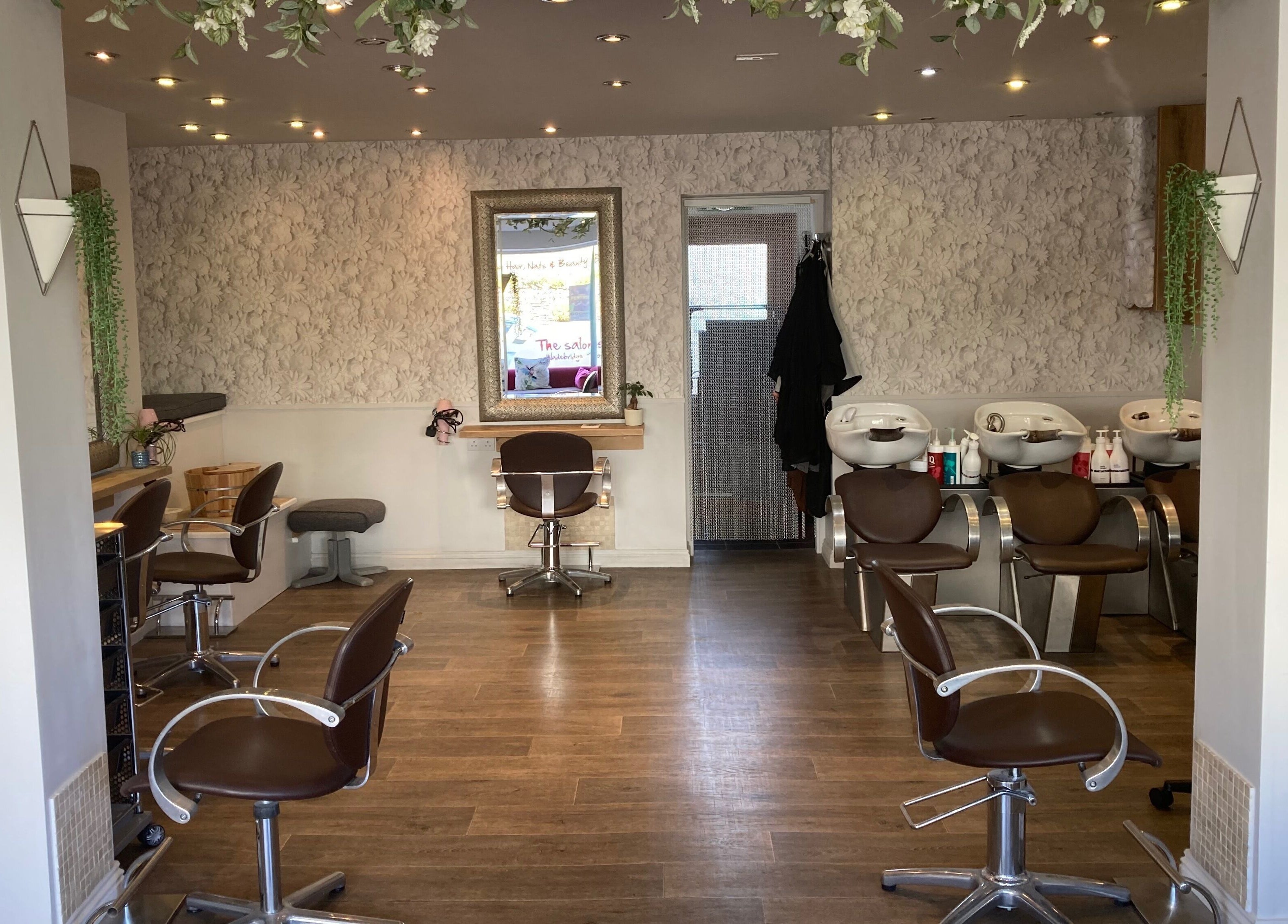 Interior of The Salon Wadebridge with stylish chairs and decor in Wadebridge, England, GB for beauty services.