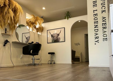 Stylish salon interior at Urban New Concept, Christchurch, Canterbury, NZ with modern decor and seating.