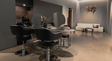 Modern salon interior at Urban New Concept, Christchurch, Canterbury, NZ with stylish seating and decor.