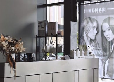 Sleek reception area at Urban New Concept, Christchurch, Canterbury, NZ with stylish decor and product display.