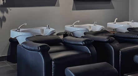 Modern wash stations at Urban New Concept, Christchurch, Canterbury, NZ offering a stylish salon experience.