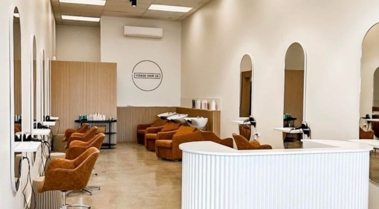 Modern salon interior at Murillo - Hair Stylist, Christchurch, Canterbury Region, NZ, with chic styling chairs.
