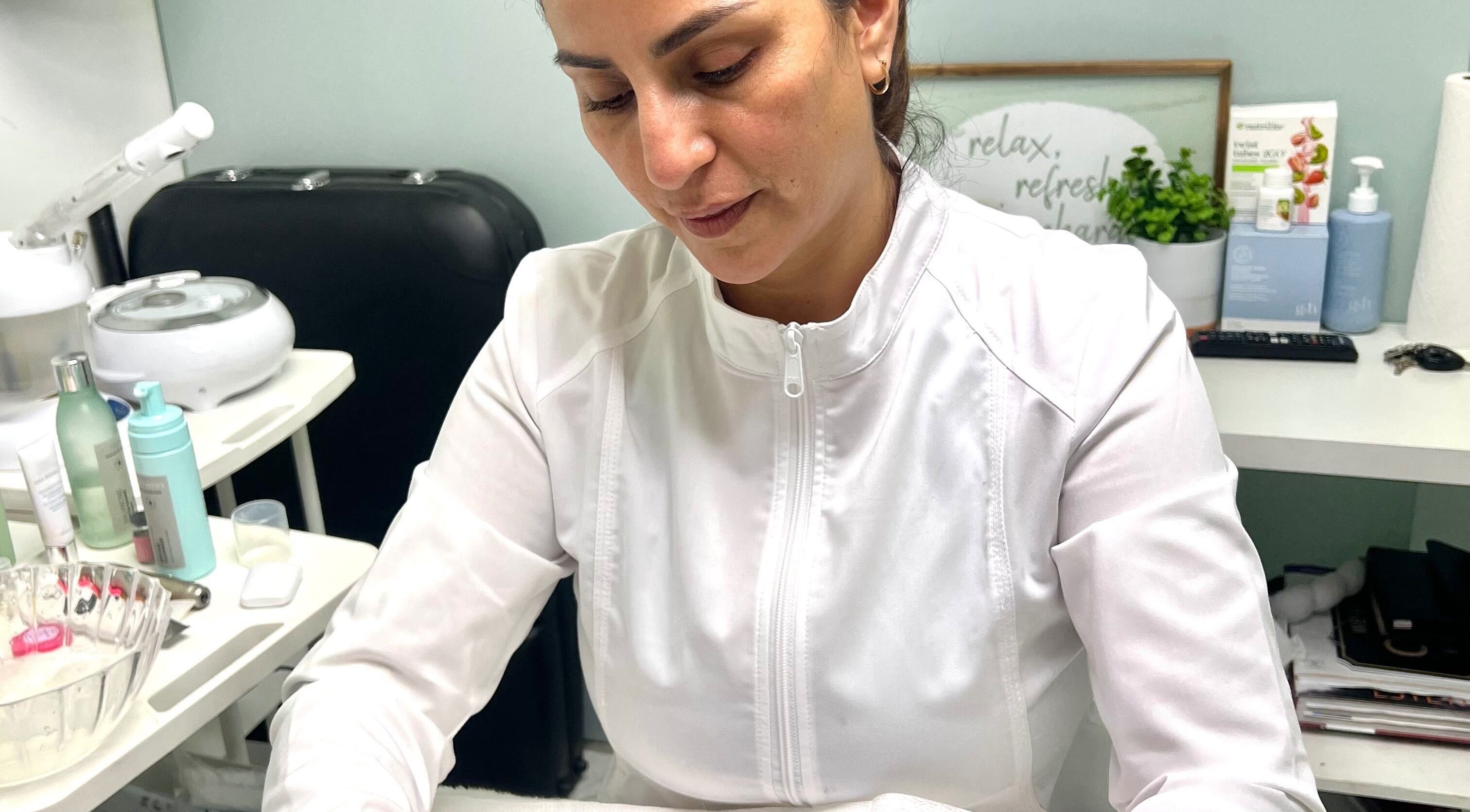 Skilled esthetician at Flourishing Med Spa in Pembroke Pines, Florida performs rejuvenating skincare treatment.