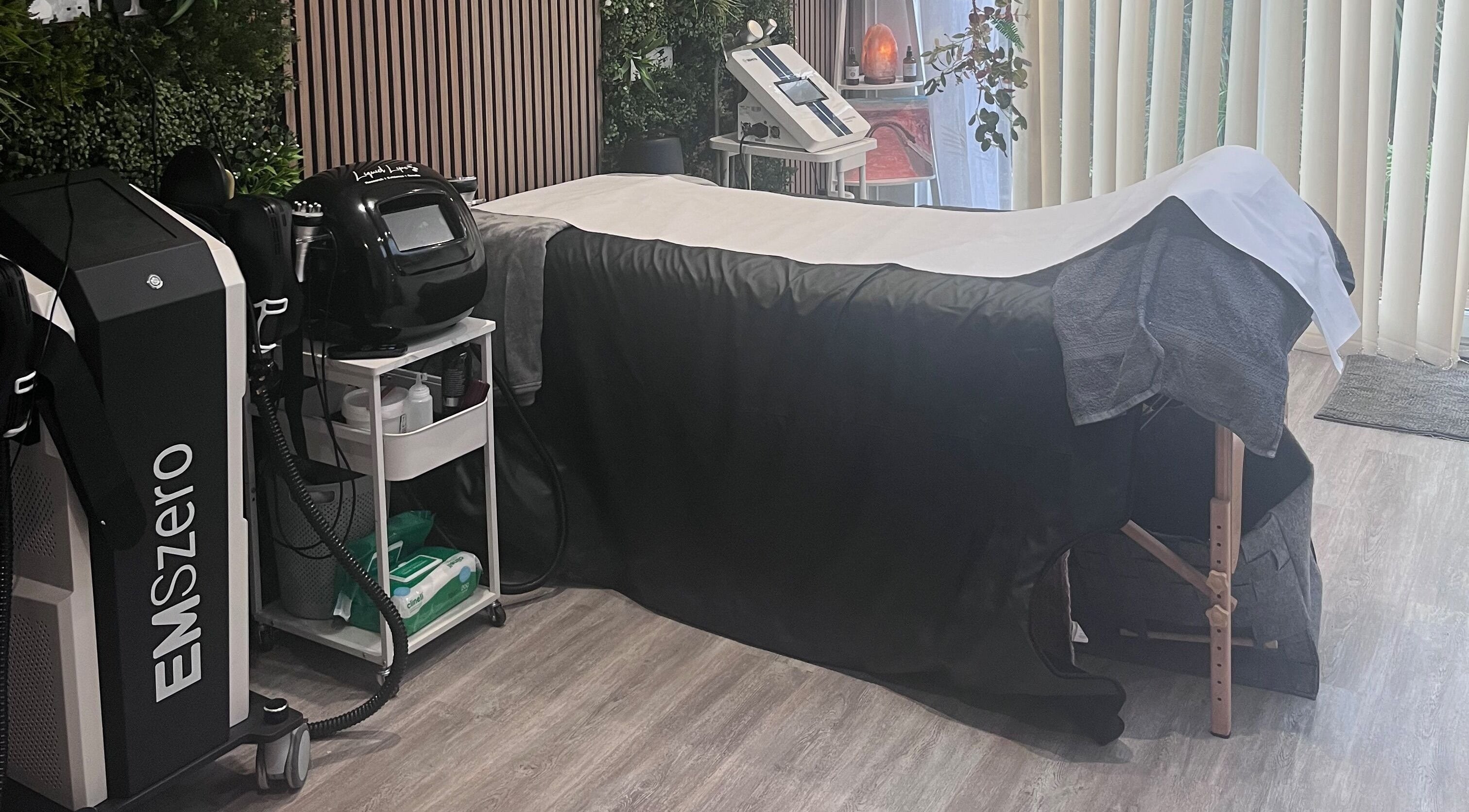 Beauty Beyond Needles, POOLE, England, GB offers a serene spa room with advanced treatment devices and a cozy massage bed.