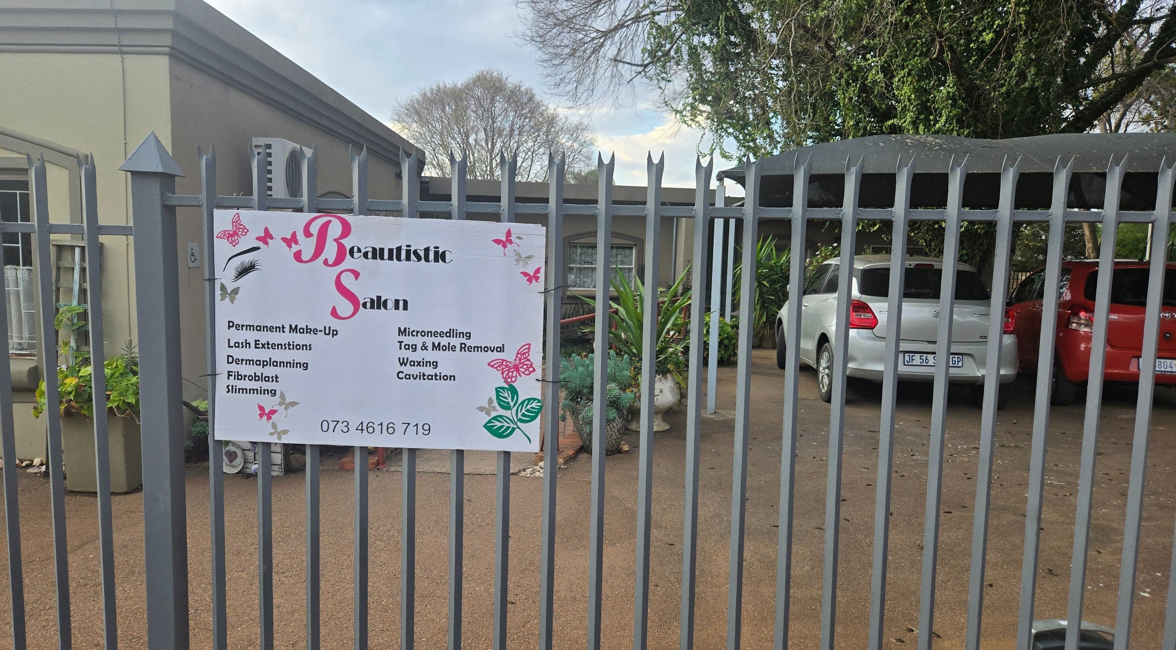 Entrance gate to Beautistic Salon in Pretoria, Gauteng, ZA showcasing salon services and contact info.