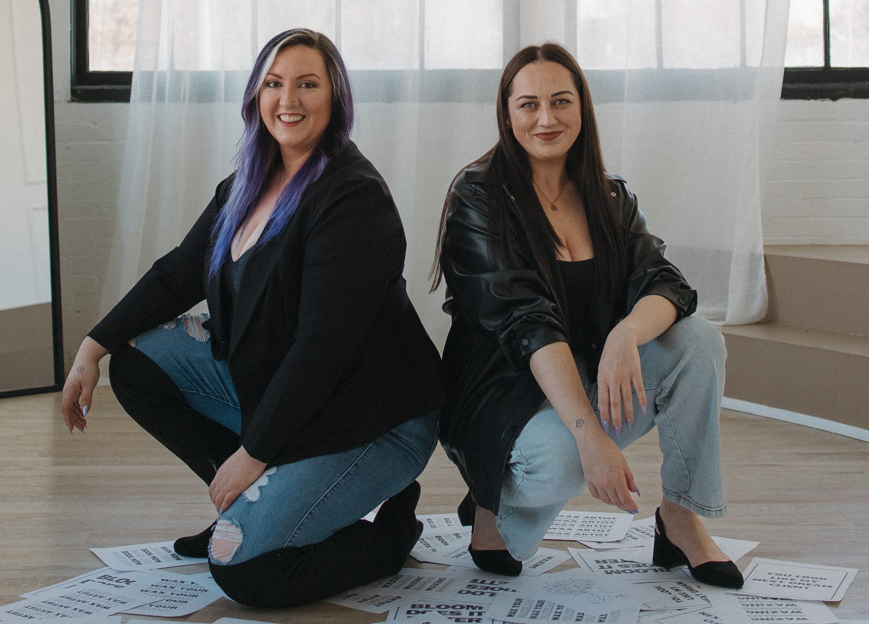 Two team members at Bloom Aesthetics, Cambridge, Ontario, CA, posing confidently indoors.