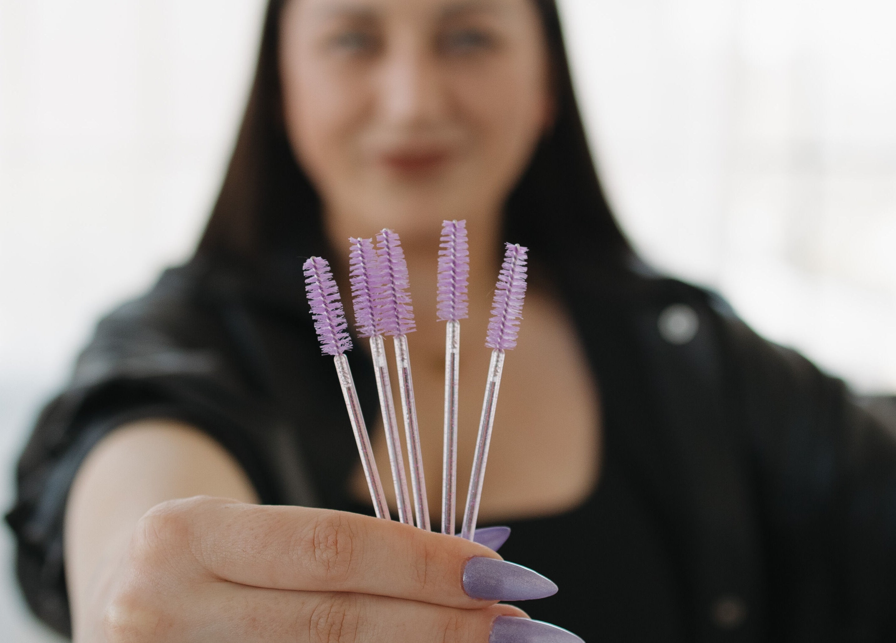 Lavender brush tools at Bloom Aesthetics, Cambridge, Ontario, CA offer precise lash grooming.
