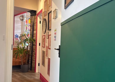 Inviting hallway at Sophie Knight Studio, Hereford, featuring vibrant decor and modern accents.
