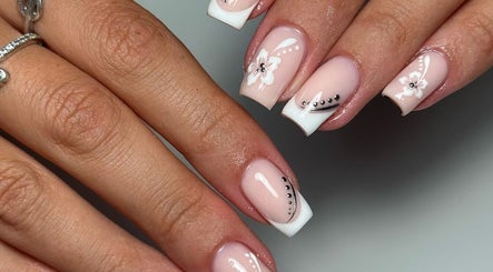 Intricate floral French nails at Kirsty’s Nails and Beauty in Chopwell, England, GB with white and pink details.