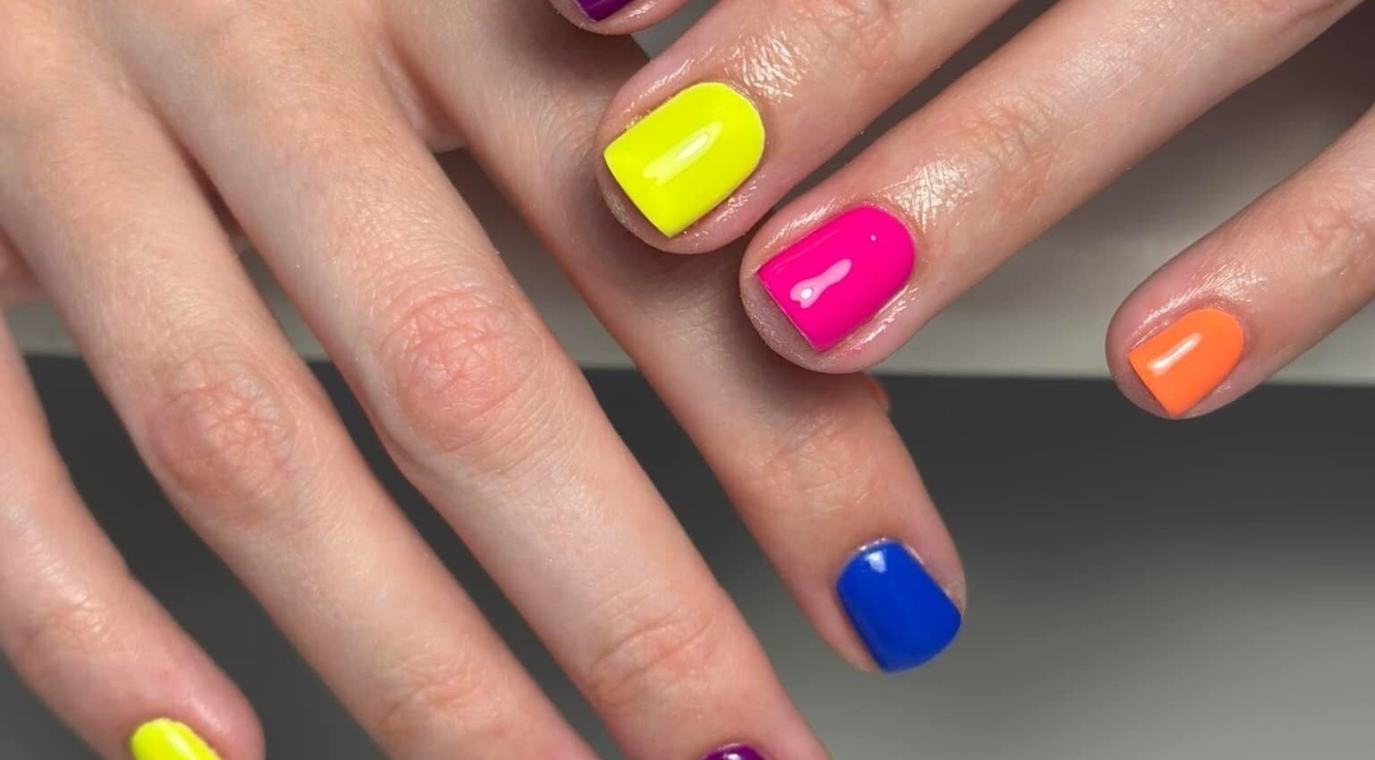 Colorful nail art at Kirsty’s Nails and Beauty, Chopwell, England, GB offers trendy vibrant manicures.
