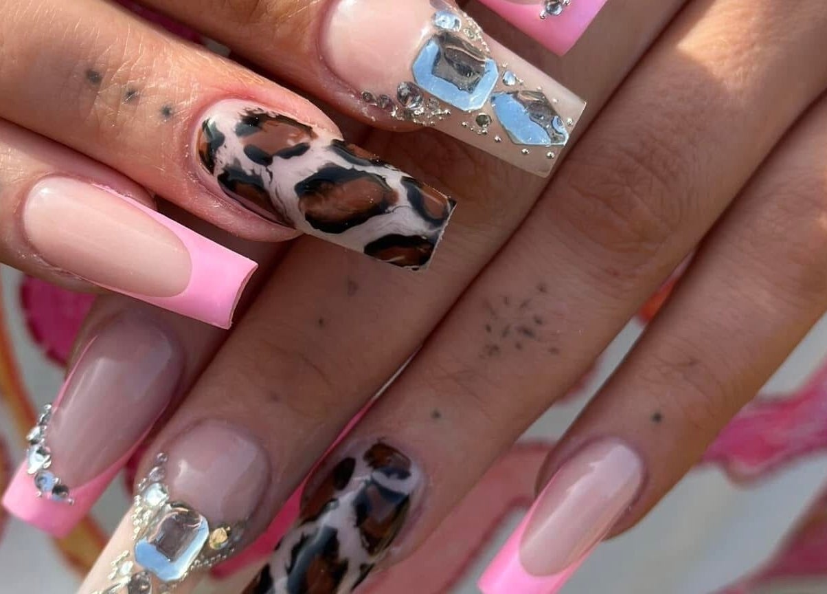 Stylish nails with pink tips and leopard accents at Kirsty’s Nails and Beauty, Chopwell, England.
