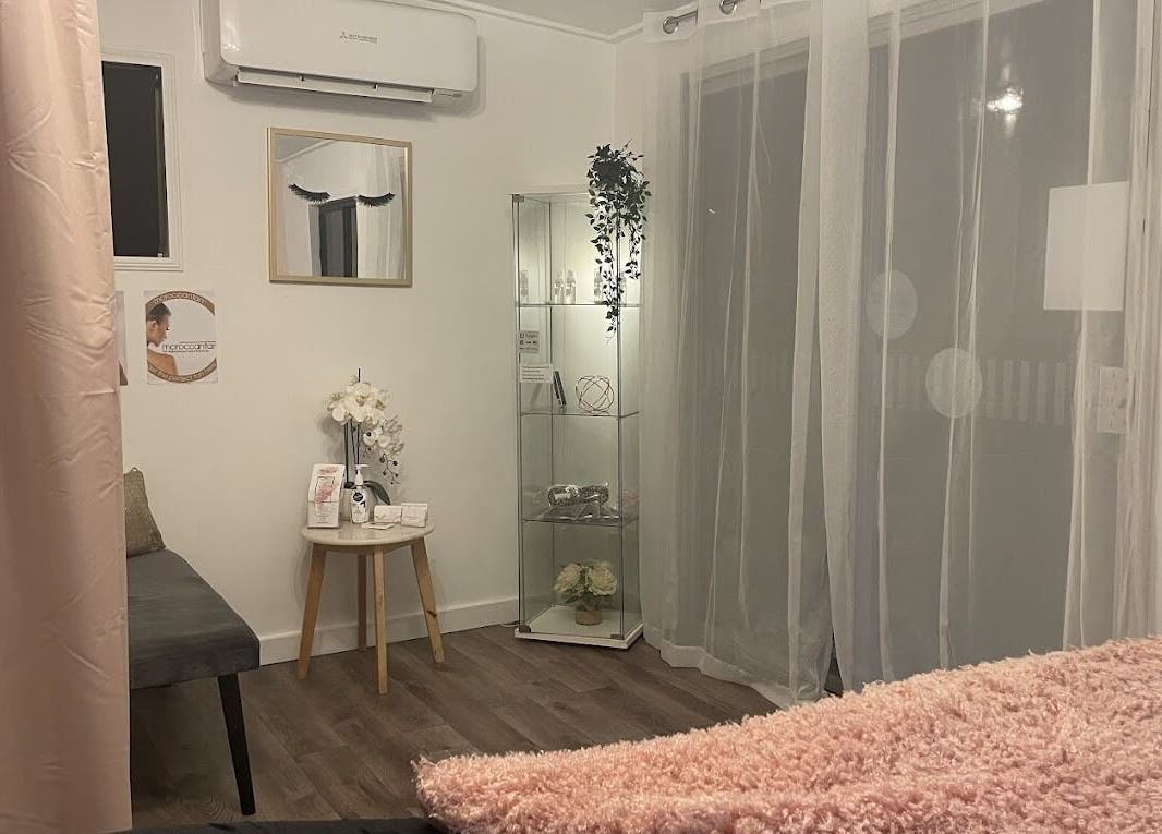 Relaxing treatment room at Beauty On Point, Victoria Point, Queensland, AU, featuring soft lighting and decor.
