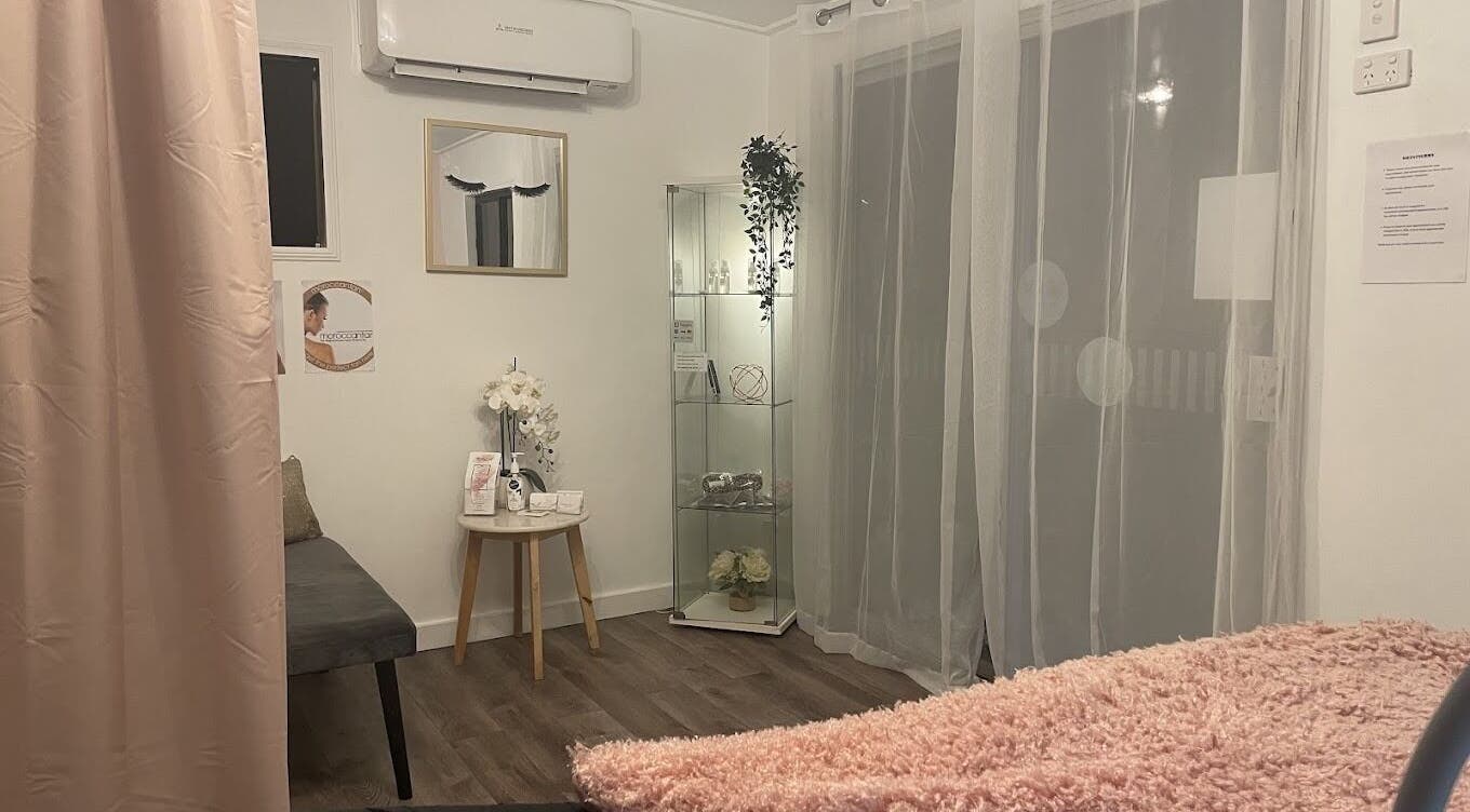 Relaxing treatment room at Beauty On Point, Victoria Point, Queensland, AU, featuring soft lighting and decor.