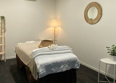 Cozy spa room at Lux Thai in Forde, Australian Capital Territory, AU with massage table and calming decor.