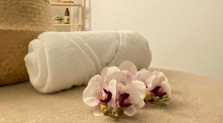 Lux Thai in Forde, Australian Capital Territory, AU offers tranquil spa ambiance with orchids and plush towels.