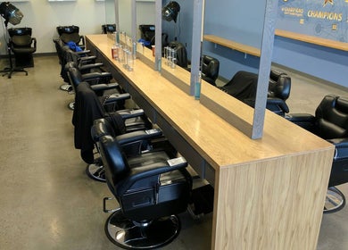 Stylish interior of Champions Barbering Institute in Portland, Oregon, US, featuring modern barber chairs.