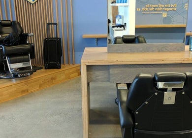 Interior of Champions Barbering Institute in Portland, Oregon, US, featuring barber chairs and modern design.