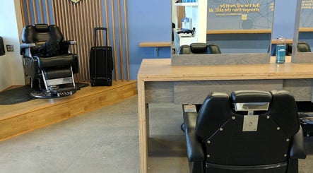 Interior of Champions Barbering Institute in Portland, Oregon, US, featuring barber chairs and modern design.