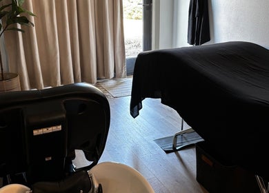 Relaxing massage room at The Spa Room in Sioux Center, Iowa, US, featuring a treatment table and tranquil decor.