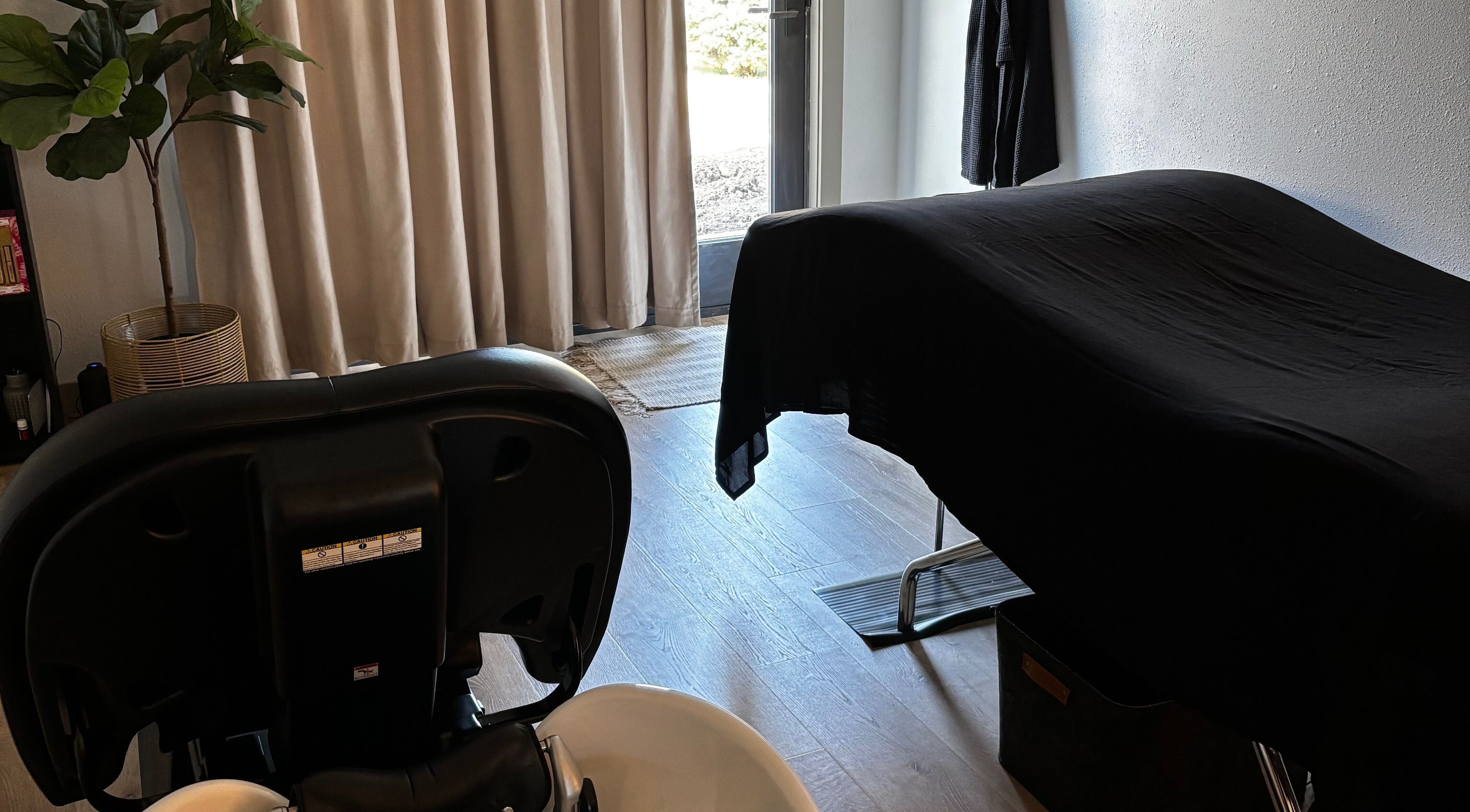 Relaxing massage room at The Spa Room in Sioux Center, Iowa, US, featuring a treatment table and tranquil decor.