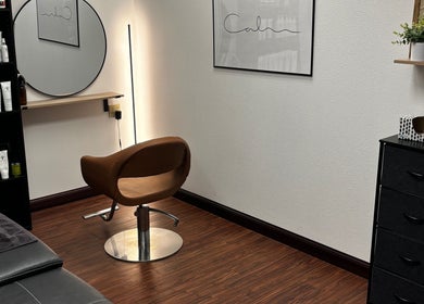 Cozy salon chair and products at The Spa Room, Sioux Center, Iowa, US, exuding calm ambiance.