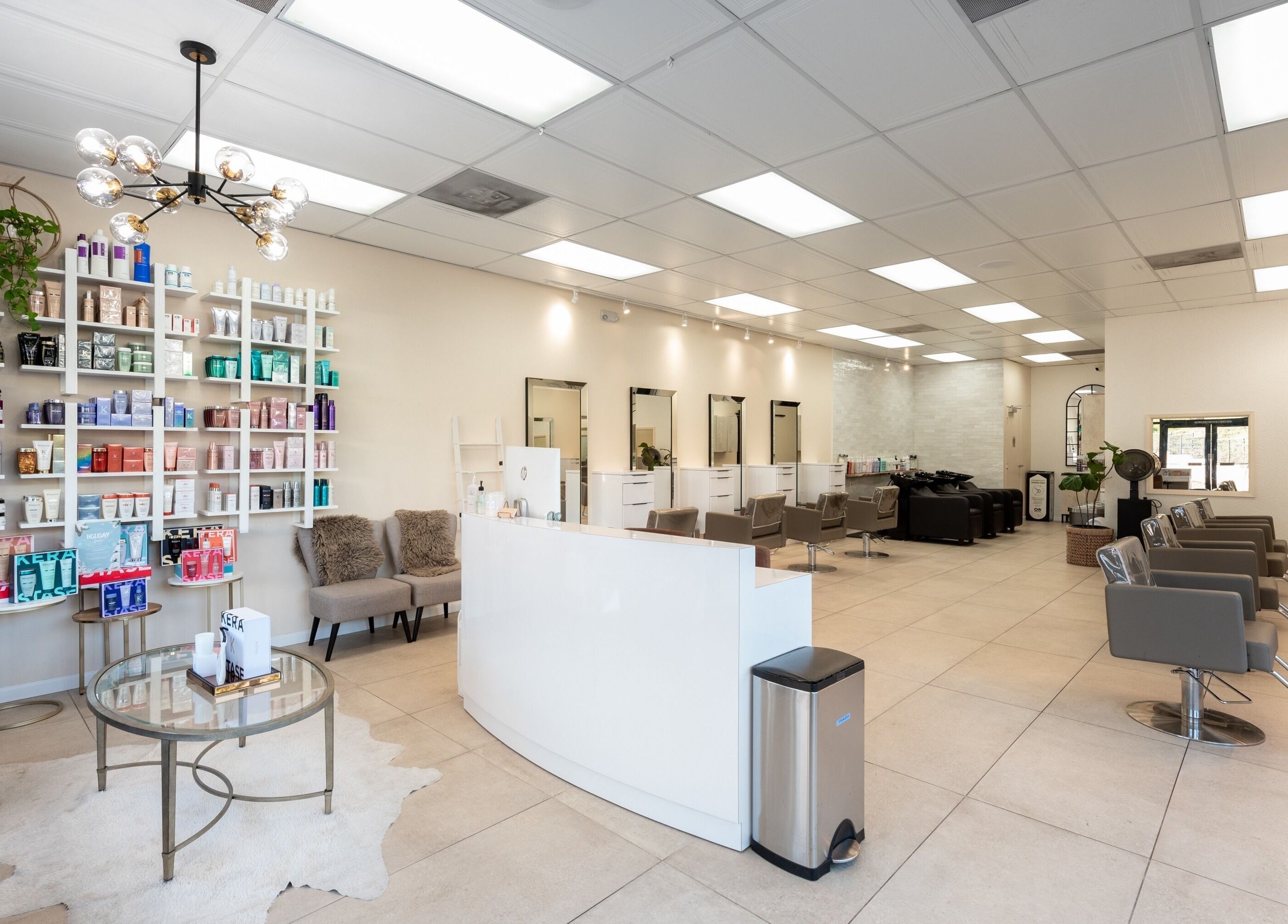 Modern styling area at Salon Ardor in San Diego, California, US, showcasing chic design and professional setup.