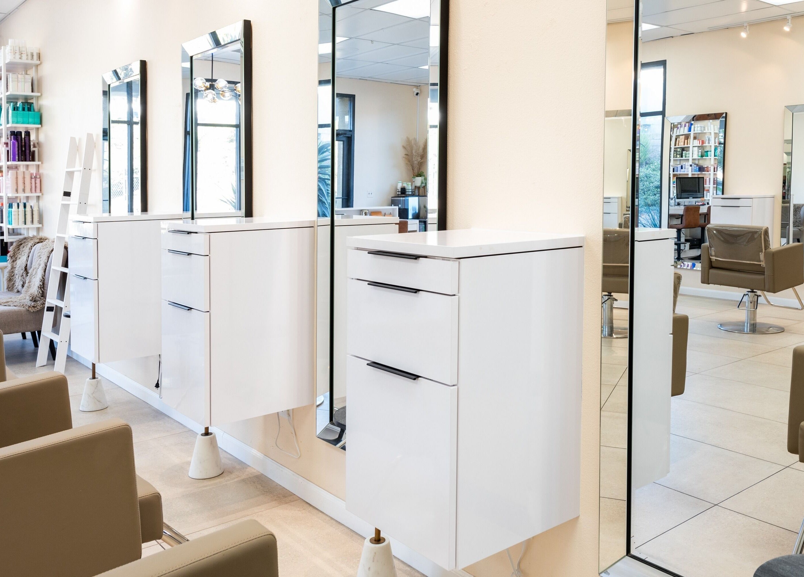 Modern interior of Salon Ardor in San Diego, California, US with sleek seating and mirrors.