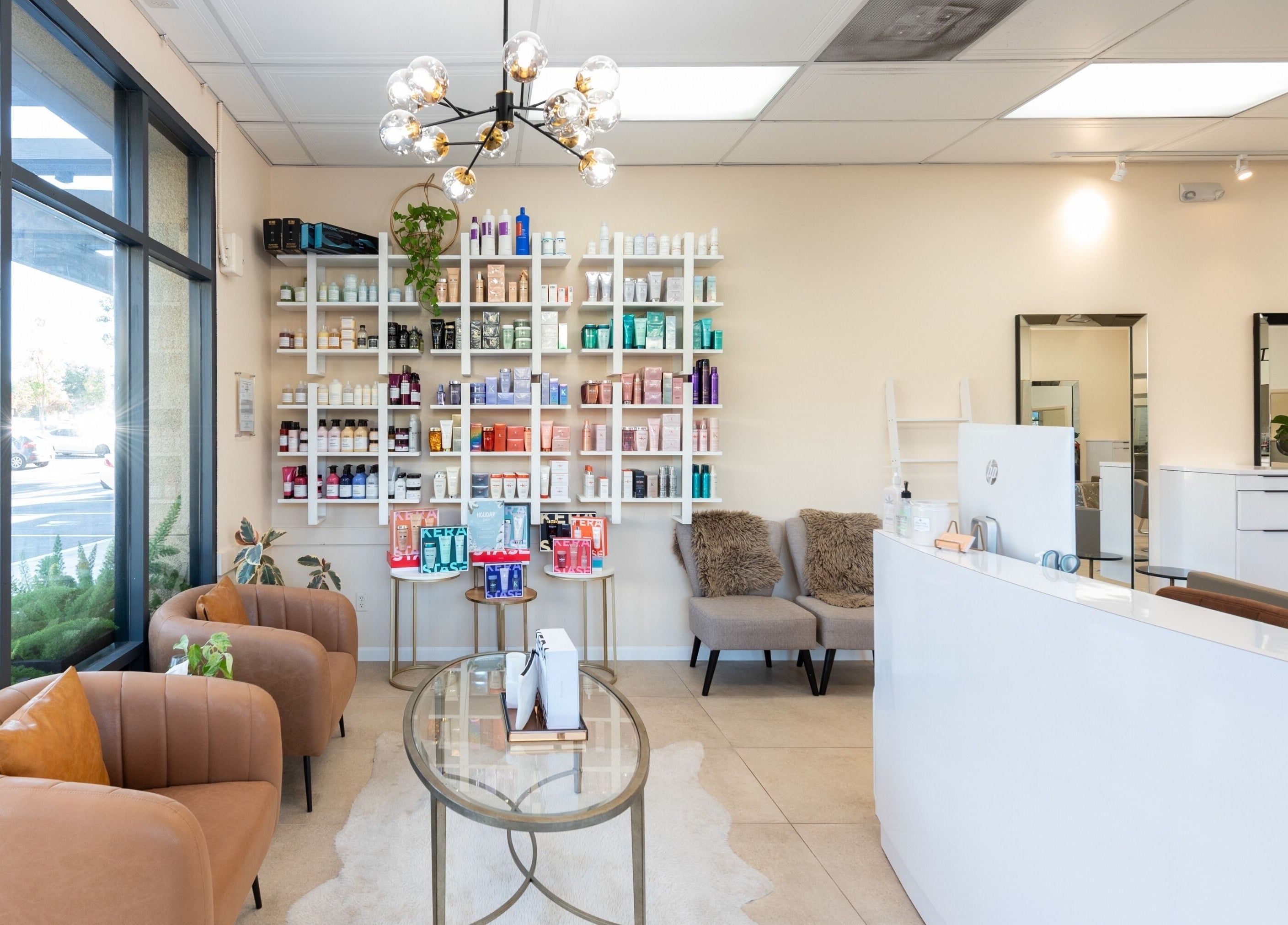 Salon Ardor's stylish reception area in San Diego, California, US with modern decor and product display.