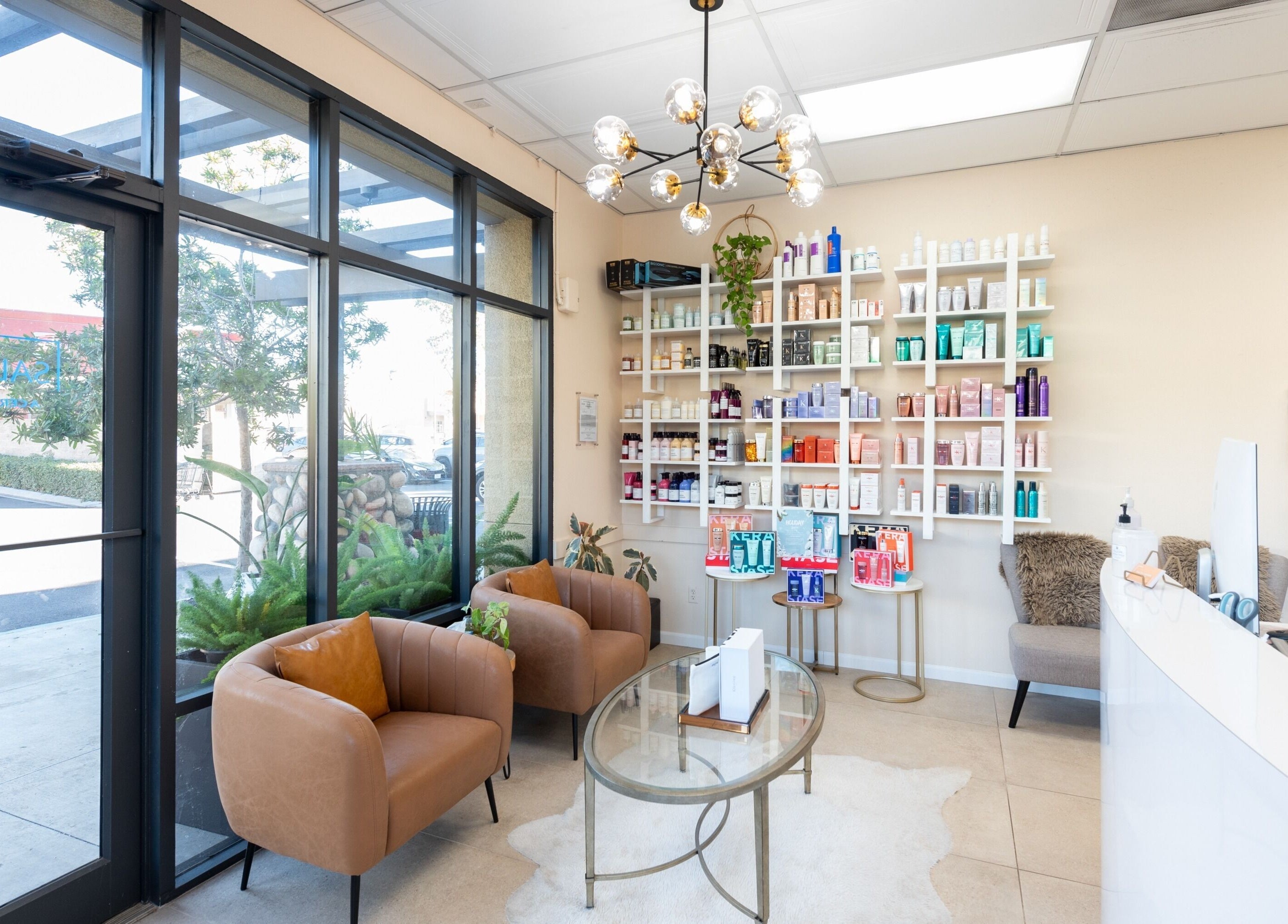Elegant interior of Salon Ardor in San Diego, California, US, featuring modern seating and product shelves.