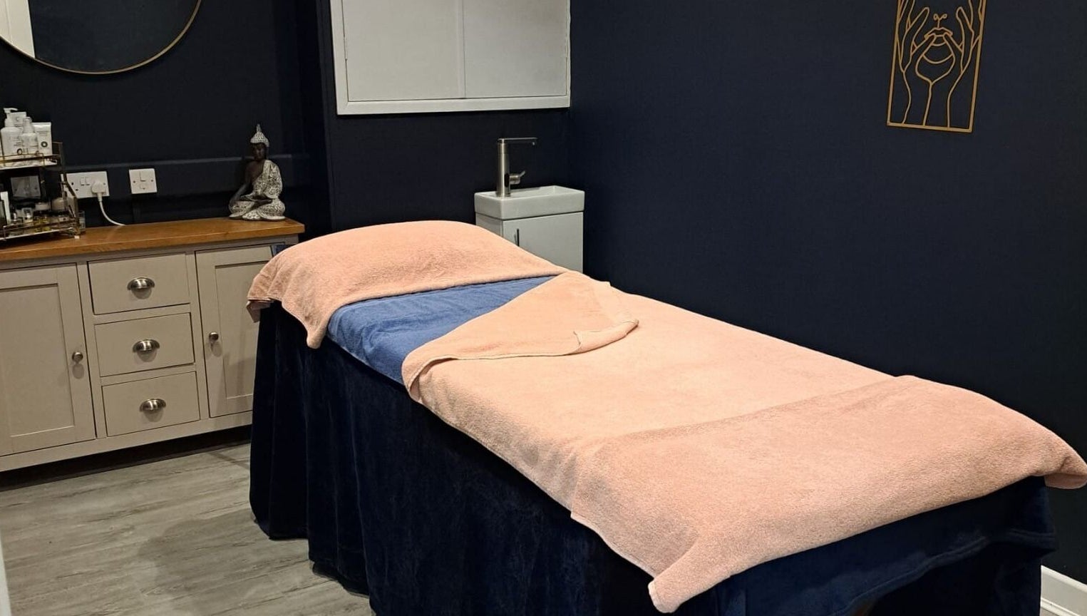 Tranquil spa room at Bespoke Beauty SP, Newton-Le-Willows, England, GB with a cushioned treatment bed.