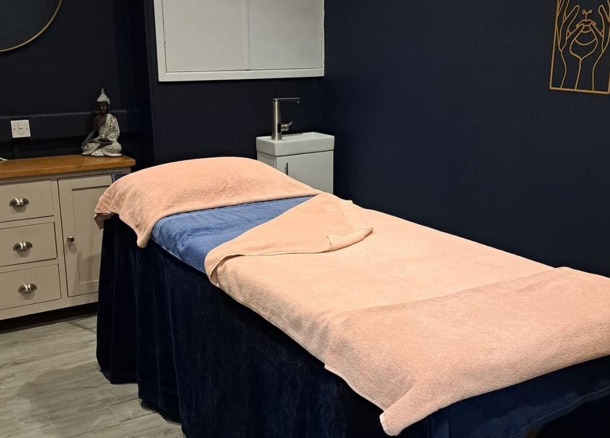 Tranquil spa room at Bespoke Beauty SP, Newton-Le-Willows, England, GB with a cushioned treatment bed.