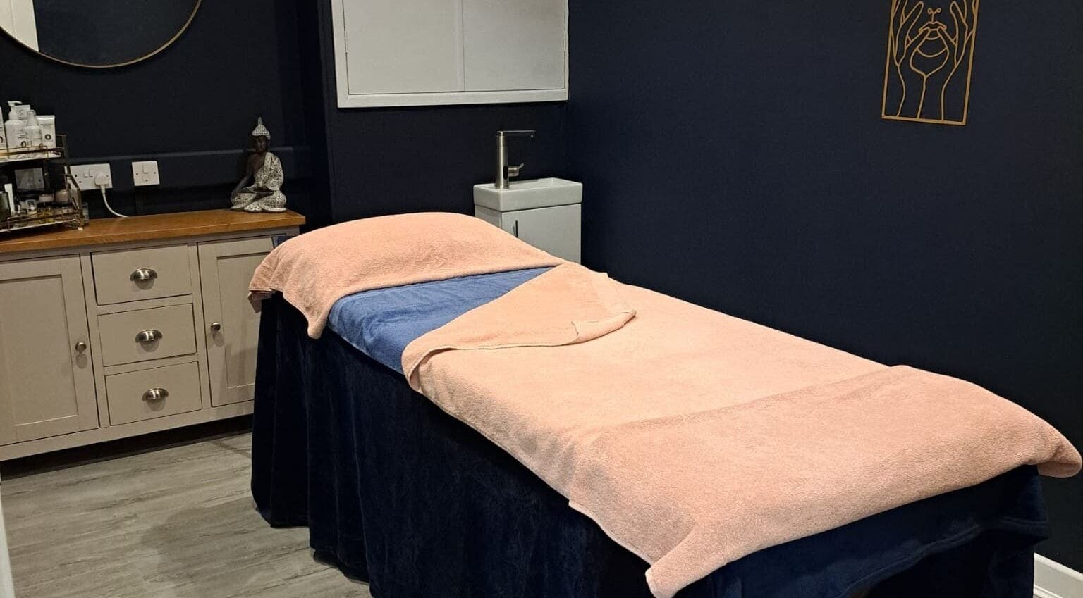 Tranquil spa room at Bespoke Beauty SP, Newton-Le-Willows, England, GB with a cushioned treatment bed.