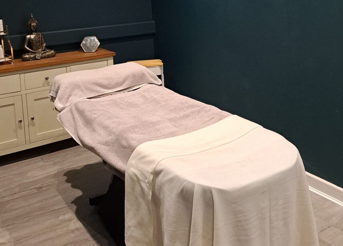 Calm treatment room at Bespoke Beauty SP, Newton-Le-Willows, England, GB with a massage table and relaxing decor.