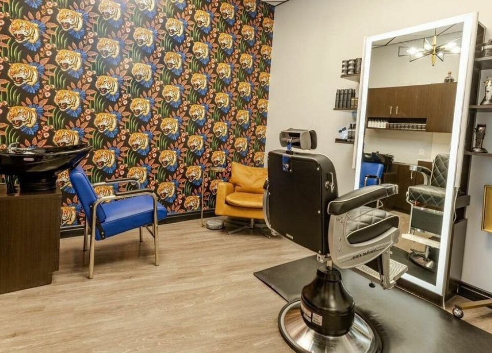 Trendy barber chair and decor at Marcos Acevedo Barbering, Somerset, New Jersey, US, showcasing vibrant style.