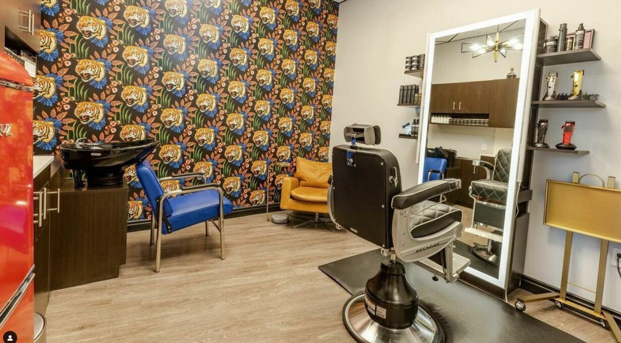 Trendy barber chair and decor at Marcos Acevedo Barbering, Somerset, New Jersey, US, showcasing vibrant style.