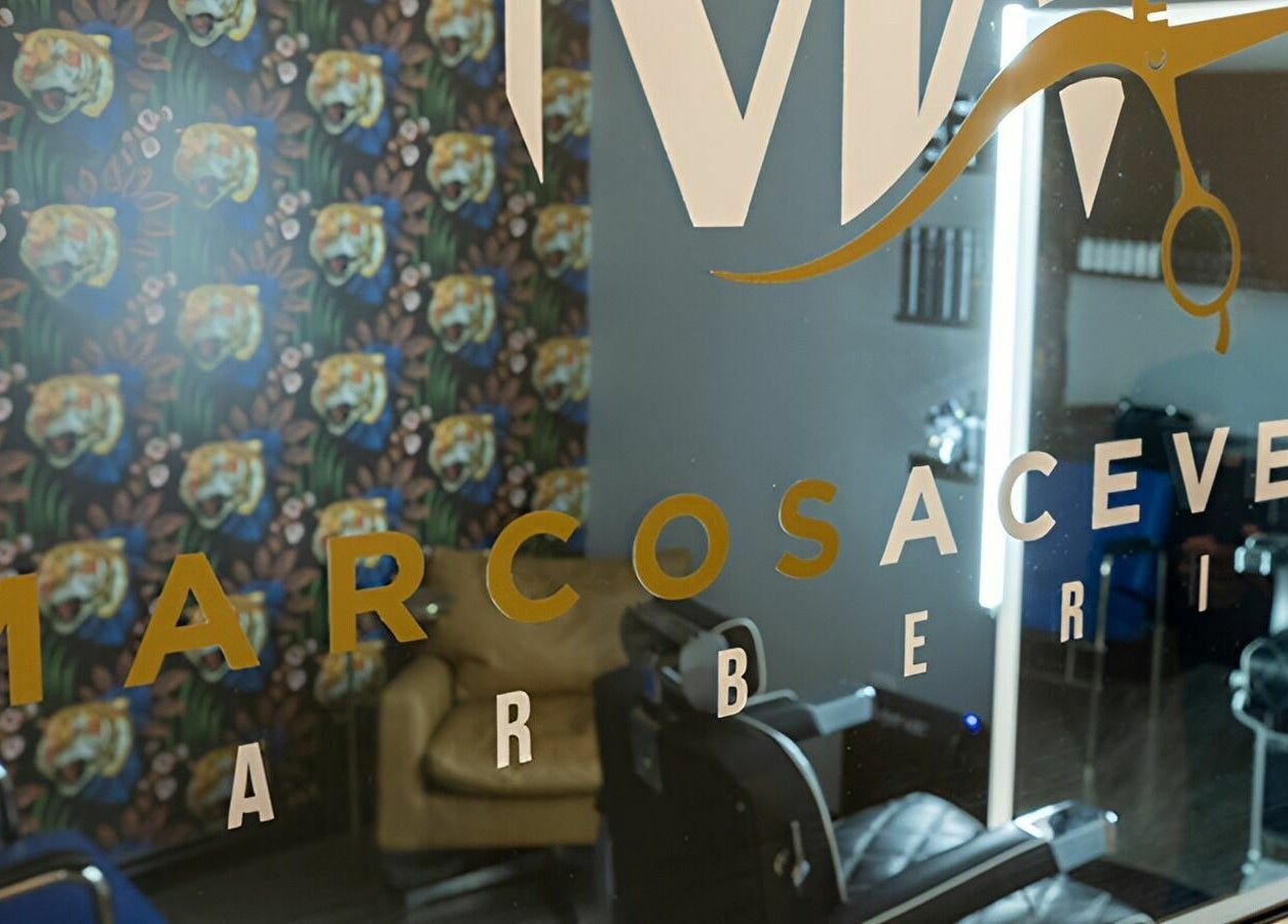 Reflection of vibrant interior at Marcos Acevedo Barbering, Somerset, New Jersey, US.