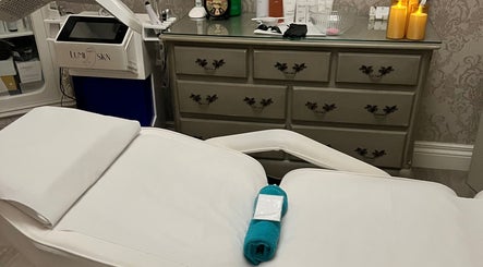 Spa treatment room at NR Derma Aesthetics, Bicester, England, GB with relaxing ambiance and professional setup.