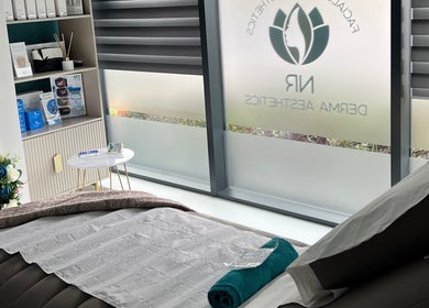 Relaxing treatment room at NR Derma Aesthetics, Bicester, England, GB showcasing a tranquil setup.