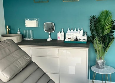 Modern treatment room at NR Derma Aesthetics in Bicester, England, GB showcasing a relaxing, stylish ambiance.